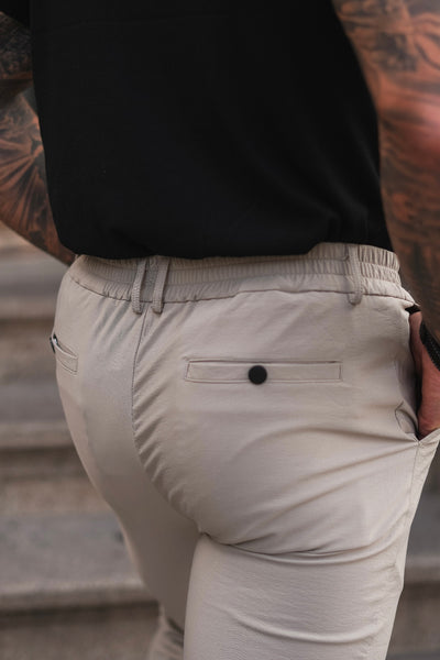 THE SLIM FIT TROUSERS - BEIGE